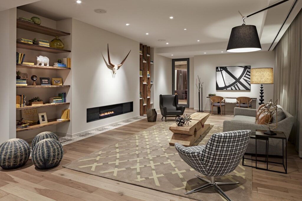 Accent lighting highlighting a modern artwork in a living room.